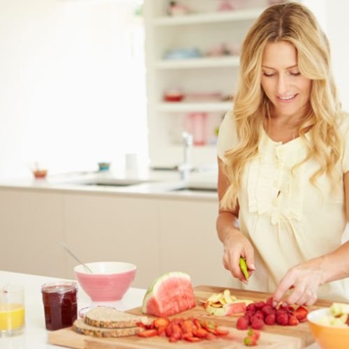 Woman preparing a healthy meal at home